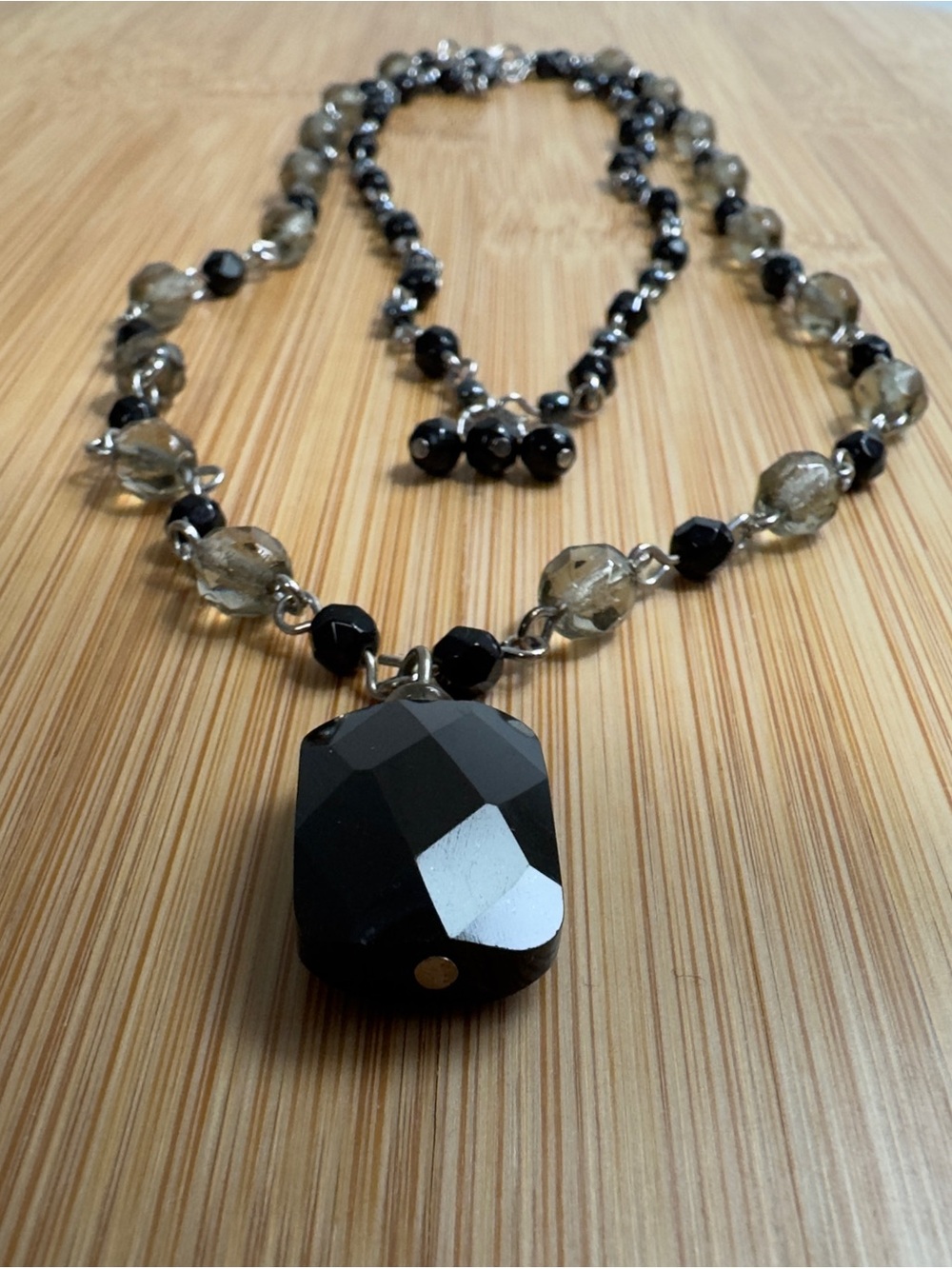 Double-strand necklace silver-tone chain with black-smoky beads, black pendant.